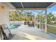 Screened pool and patio with comfortable seating at 10451 Keystone St, Spring Hill, FL 34608