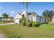 House exterior with landscaping and driveway at 11243 Merganser Way, New Port Richey, FL 34654