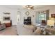 Comfortable living room featuring a fireplace and sliding doors to a patio at 11243 Merganser Way, New Port Richey, FL 34654