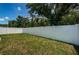 Large backyard enclosed by a white vinyl fence at 11922 Bristol Bridge Rd, Spring Hill, FL 34610