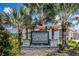 Conner Crossing community entrance sign with palm trees at 11922 Bristol Bridge Rd, Spring Hill, FL 34610