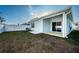 Home exterior with covered patio and fenced yard at 11922 Bristol Bridge Rd, Spring Hill, FL 34610