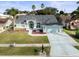 Single-story house with a large driveway and yard at 1230 Venetia Dr, Spring Hill, FL 34608