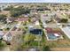 Aerial view of single-Gathering home with solar panels and pool in a residential neighborhood at 1230 Venetia Dr, Spring Hill, FL 34608