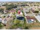 Aerial view of single-Gathering home with solar panels and pool in a residential neighborhood at 1230 Venetia Dr, Spring Hill, FL 34608