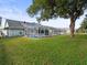 Spacious backyard with a pool and lush green grass at 1230 Venetia Dr, Spring Hill, FL 34608