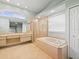 Main bathroom featuring double sinks, tub, and shower at 1230 Venetia Dr, Spring Hill, FL 34608