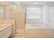 Bathroom with shower and bathtub at 1230 Venetia Dr, Spring Hill, FL 34608