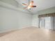 Serene bedroom with tile floors and sliding glass doors at 1230 Venetia Dr, Spring Hill, FL 34608