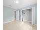 Bright bedroom with tile floors and spacious closet at 1230 Venetia Dr, Spring Hill, FL 34608