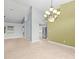 Open dining area with a view into the kitchen and living room at 1230 Venetia Dr, Spring Hill, FL 34608