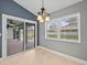 Bright dining area with sliding glass doors leading to the pool at 1230 Venetia Dr, Spring Hill, FL 34608