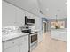 Modern kitchen with stainless steel appliances and granite countertops at 1230 Venetia Dr, Spring Hill, FL 34608
