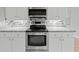 Modern kitchen with stainless steel appliances and granite countertops at 1230 Venetia Dr, Spring Hill, FL 34608