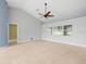 Open living room with large window and tile flooring at 1230 Venetia Dr, Spring Hill, FL 34608