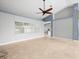 Bright living room features a large window and tile flooring at 1230 Venetia Dr, Spring Hill, FL 34608
