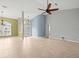 Bright living room featuring tile floors and a view of the entryway at 1230 Venetia Dr, Spring Hill, FL 34608