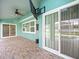 Outdoor patio with sliding doors and brick pavers at 1230 Venetia Dr, Spring Hill, FL 34608