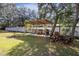 Covered patio area with grill and space for outdoor cooking at 12910 Oak Nut St, Hudson, FL 34667