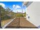 Landscaped backyard with mulch beds and fence at 13124 Lawrence St, Spring Hill, FL 34609