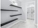Bathroom with floating shelves and modern vanity at 13124 Lawrence St, Spring Hill, FL 34609
