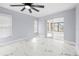 Bedroom with marble floors and access to the sunroom at 13124 Lawrence St, Spring Hill, FL 34609