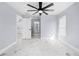 Bedroom with marble floors and access to bathroom at 13124 Lawrence St, Spring Hill, FL 34609