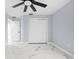 Light and airy bedroom with ceiling fan and double-door closet at 13124 Lawrence St, Spring Hill, FL 34609