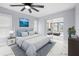 Main bedroom with a king-size bed and access to the sunroom at 13124 Lawrence St, Spring Hill, FL 34609