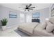 Spacious bedroom with ceiling fan, large bed, and marble floors at 13124 Lawrence St, Spring Hill, FL 34609