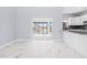 Dining area with marble floors and access to the pool area at 13124 Lawrence St, Spring Hill, FL 34609