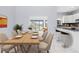 Dining room with wood table and view of the pool at 13124 Lawrence St, Spring Hill, FL 34609