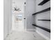 Hallway with marble floors and access to bedrooms at 13124 Lawrence St, Spring Hill, FL 34609