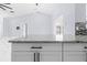 Kitchen island with granite countertop and white cabinets at 13124 Lawrence St, Spring Hill, FL 34609