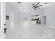 Open living area with marble floors and modern ceiling fan at 13124 Lawrence St, Spring Hill, FL 34609