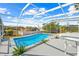 Screened pool with ample space for lounging at 13124 Lawrence St, Spring Hill, FL 34609