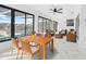 Sunroom features a dining area, wicker furniture, and marble floors at 13124 Lawrence St, Spring Hill, FL 34609