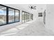 Spacious sunroom with marble floors and access to the pool at 13124 Lawrence St, Spring Hill, FL 34609