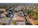 Aerial view of a house in a residential neighborhood with lush green trees at 13793 Dunwoody Dr, Spring Hill, FL 34609