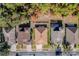 Aerial view of houses with brown roofs and green trees at 13793 Dunwoody Dr, Spring Hill, FL 34609