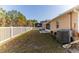 Spacious backyard with white fence and AC unit at 13793 Dunwoody Dr, Spring Hill, FL 34609