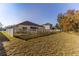 Large backyard with white fence and home view at 13793 Dunwoody Dr, Spring Hill, FL 34609