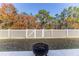 Private backyard with fire pit and white fence at 13793 Dunwoody Dr, Spring Hill, FL 34609