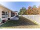 Backyard with white fence and fire pit at 13793 Dunwoody Dr, Spring Hill, FL 34609