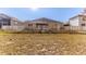 Sunny backyard with white fence and home view at 13793 Dunwoody Dr, Spring Hill, FL 34609