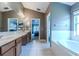 Bathroom with double vanity, garden tub, and separate shower at 13793 Dunwoody Dr, Spring Hill, FL 34609