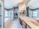 Bathroom with double sinks, soaking tub, and separate shower at 13793 Dunwoody Dr, Spring Hill, FL 34609