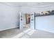Bedroom with built-in shelves and view into another room at 13793 Dunwoody Dr, Spring Hill, FL 34609