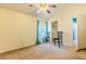 Spacious bedroom with ceiling fan, neutral walls, and teal curtains at 13793 Dunwoody Dr, Spring Hill, FL 34609