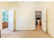 Bedroom with access to bathroom and view into kitchen at 13793 Dunwoody Dr, Spring Hill, FL 34609